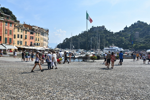 Portofino, Italy - August 31, 2019:  the picturesque coastal village of Portofino, Italy. Popular tourist destination and cruise ships in the Ligurian sea.