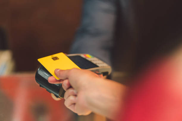 istock Person paying with a credit card 1327618713