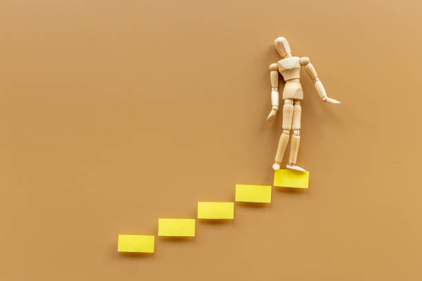 istock Human mannequin figure on stairs. Developtment and career growth 1327619044