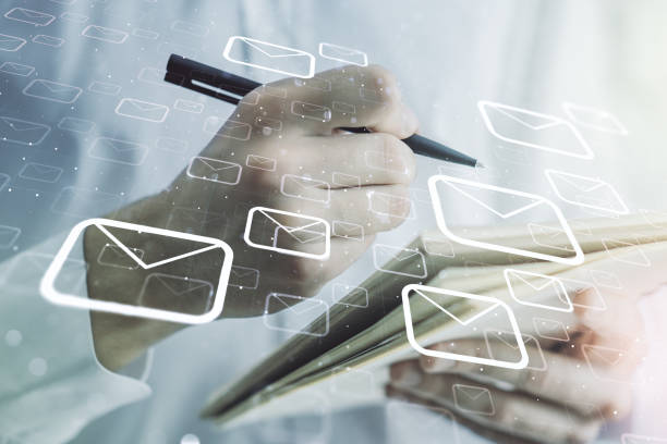 istock Creative concept of postal envelopes illustration with hand writing in notebook on background. Email and communications concept. Multiexposure 1327620215