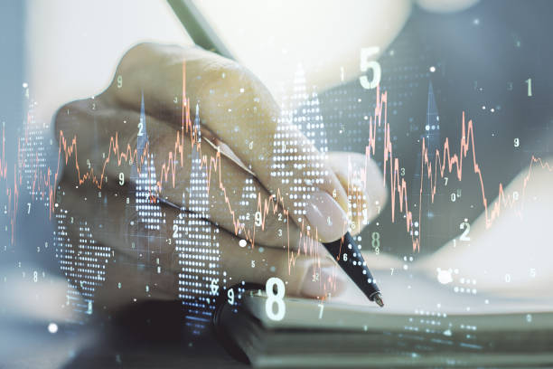 istock Abstract creative financial graph with hand writing in diary on background, financial and trading concept. Multiexposure 1327620237