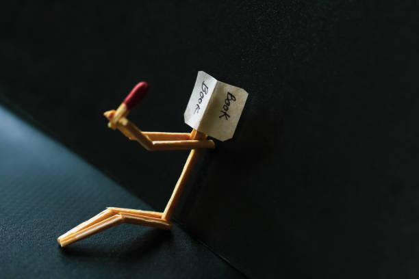 istock Matchstick concept and ideas. Book reading concept and ideas. Matchstick reading a book with black background. 1327621914