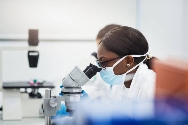 istock Shot of a young scientist using a microscope while conducting medical research in a laboratory 1327623440