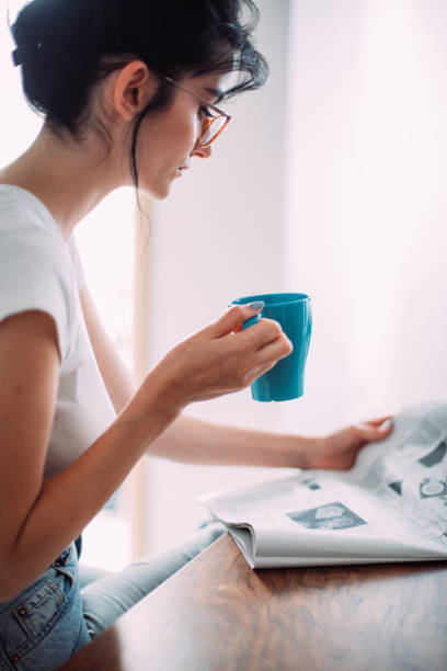 istock Beautiful woman in her kitchen 1327623626