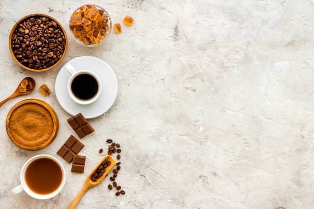 istock Coffee beans and powder with hot chocolate in white cup. Top view, flat lay 1327623737