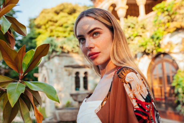 istock Latin woman posing in front of castle 1327625348