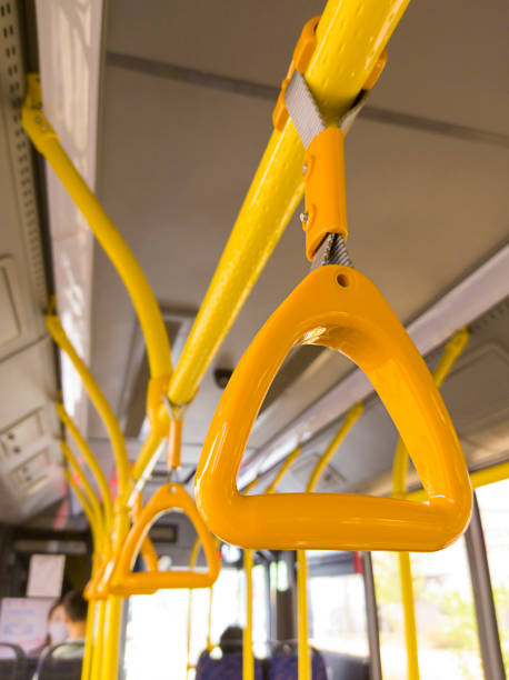 istock Yellow handrails inside the bus. Half-empty public transport 1327626547