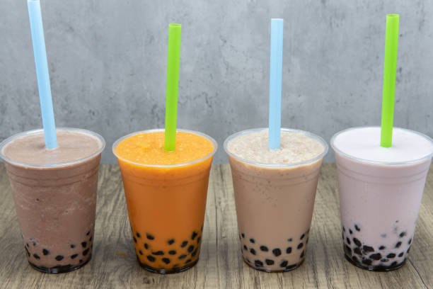 Delicious cold beverage for that sweet craving Various colors and flavored smoothies with sweet tapioca boba balls at the bottom of the cup for flavor. bubble tea photos stock pictures, royalty-free photos & images