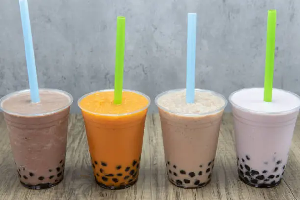 Various colors and flavored smoothies with sweet tapioca boba balls at the bottom of the cup for flavor.