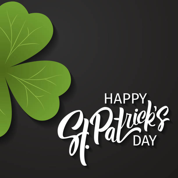 istock Happy St. Patrick's Day greeting. Lettering St. Patrick's Day on a dark background with shamrock. 1327631007