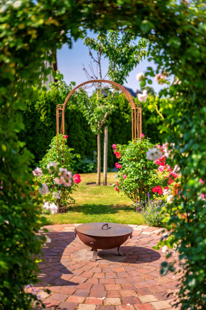 istock Colorful garden with rose arch and fireplace 1327631014