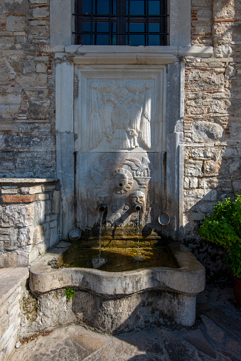 Water fountain at the Moni Timiou Stavrou Monastery on Samos Island, Greece.