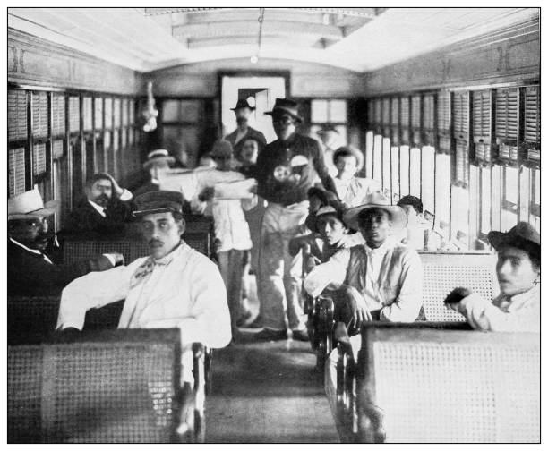 Antique black and white photograph of people from islands in the Caribbean and in the Pacific Ocean; Cuba, Hawaii, Philippines and others: Railway, Havana, Cuba