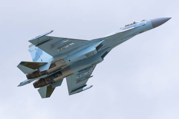 istock Fast fighter plane in the sky flies unarmed. 1327634458