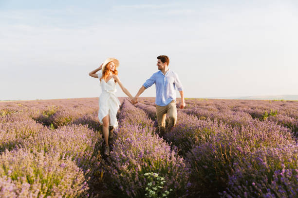 istock Smiling young couple embracing at the lavender field 1327637346