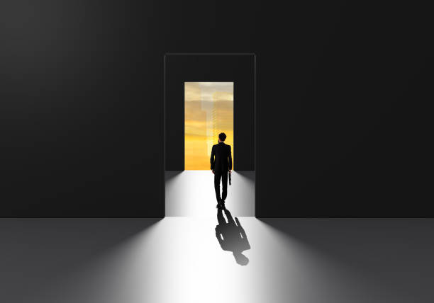 istock Businessman walking through success door 1327640499
