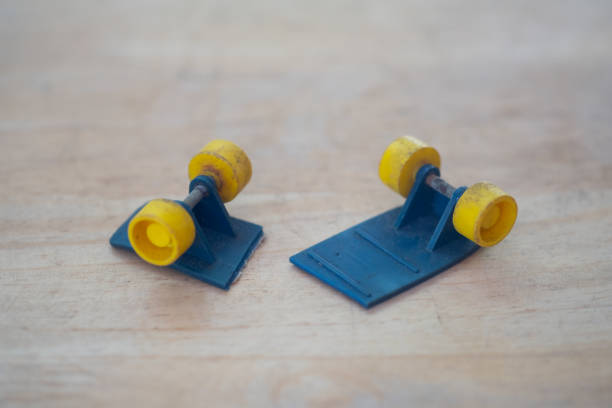 istock Mini toy broken in half skateboard on wood table 1327643165