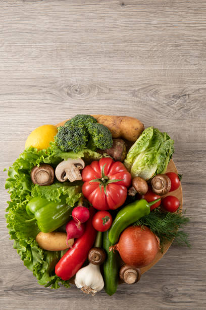 istock Fresh Vegetables on Wooden Background 1327643638