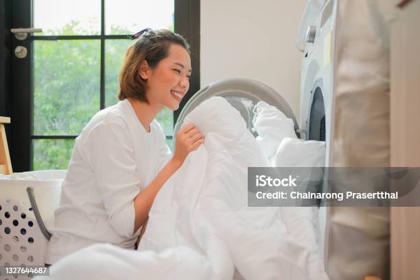 Close Up Young Beautiful Asian Woman Smelling The White Blanket After Finished From Wash Machine In Home For Daily And Routine Lifestyle Concept Stock Photo - Download Image Now