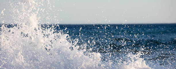 istock Waves splashed on a very windy day at sunset, blue sea 1327644772