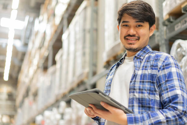 istock close up middle eastern auditor man use digital tablet device to check order in storage at distribution warehouse cargo for manage about delivery of import and export business concept 1327645726