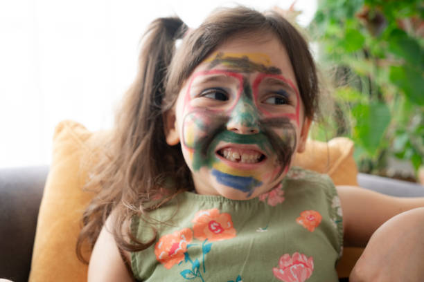 istock Smiling little girl with a painted face 1327646438