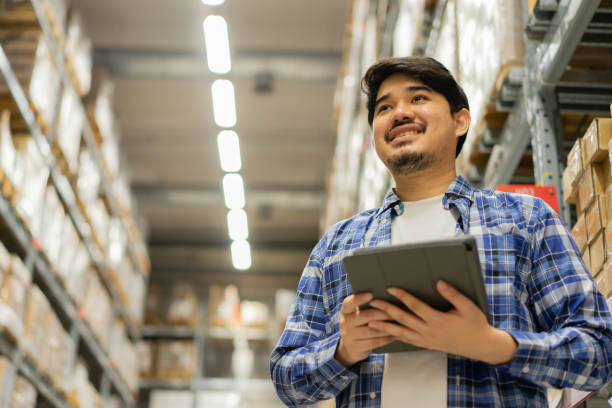 istock close up perspective candid of middle eastern auditor man use digital tablet device to check order in storage at distribution warehouse cargo for manage about delivery of import and export business concept 1327646476