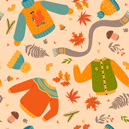 Autumn seamless pattern with clothes and leaves. Vector image.