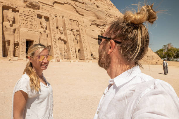istock Couple travel in Egypt, contemplate ancient temple 1327652192