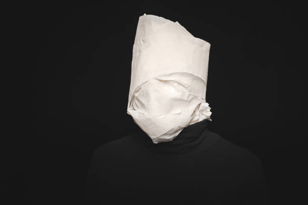 istock Man head wrapped in toilet paper 1327653169