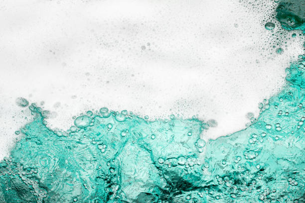 Blue sea water white foam texture background closeup, foamy ocean wave pattern, aqua bubbles surface, swimming pool backdrop, abstract summer sunny beach wallpaper, decorative frame border, copy space