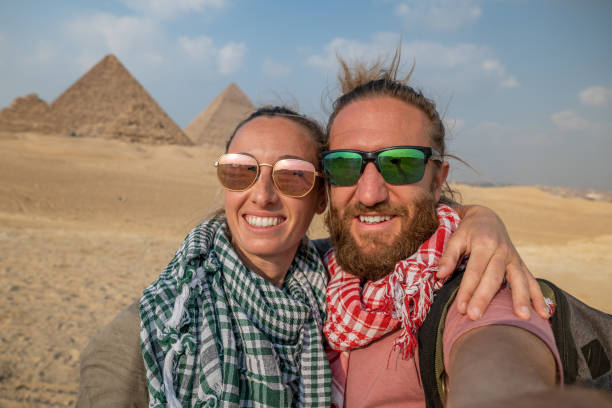 istock Couple take selfie at the pyramids, Egypt 1327654247