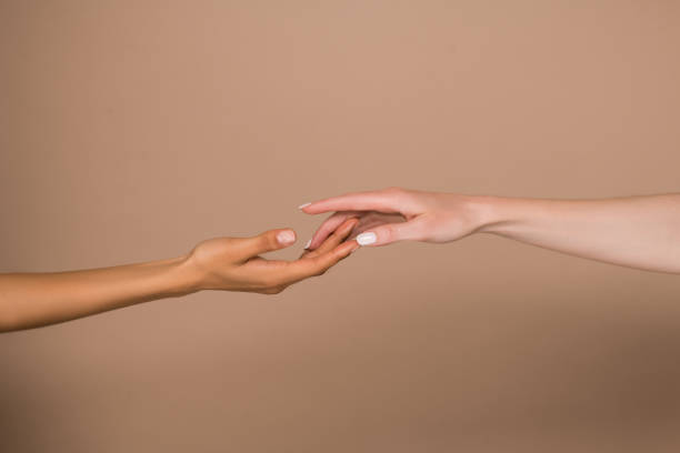 istock A close up picture of female clasped hands 1327655113