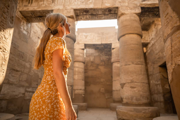 istock Woman explores ancient temples in Egypt 1327655124