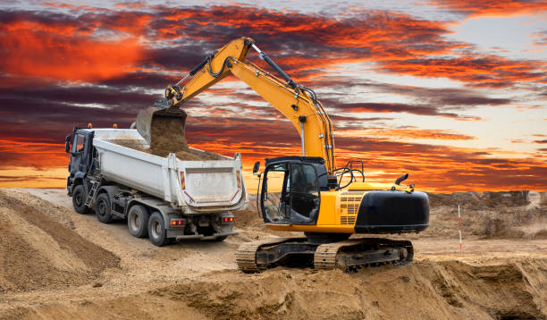 istock earth mover and excavator at work in construction site 1327655135