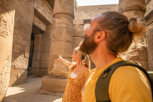 istock Couple travel in Egypt, explore the ancient temples in Luxor 1327655556