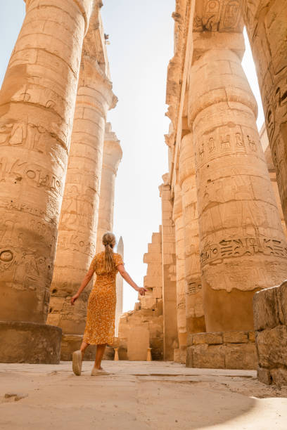 istock Woman explores ancient temples in Egypt 1327655560