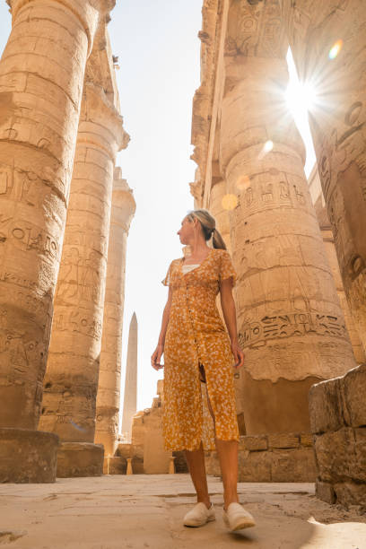 istock Woman explores ancient temples in Egypt 1327655740