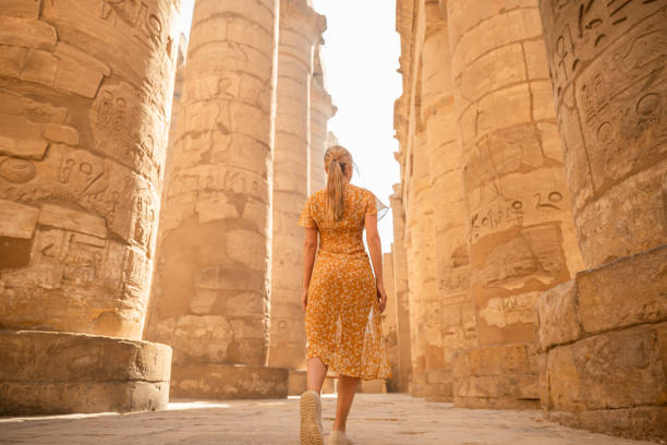 istock Woman explores ancient temples in Egypt 1327656263