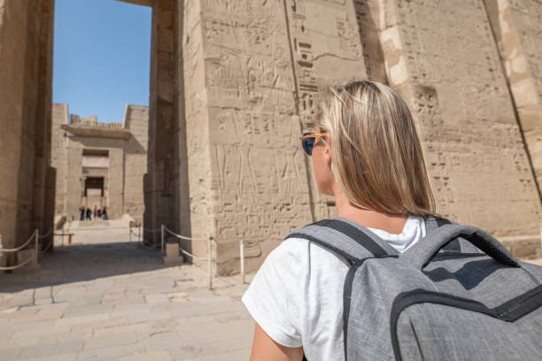 istock Woman explores ancient temples in Egypt 1327656396