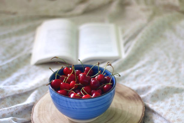 istock Cherries and Books 1327658379
