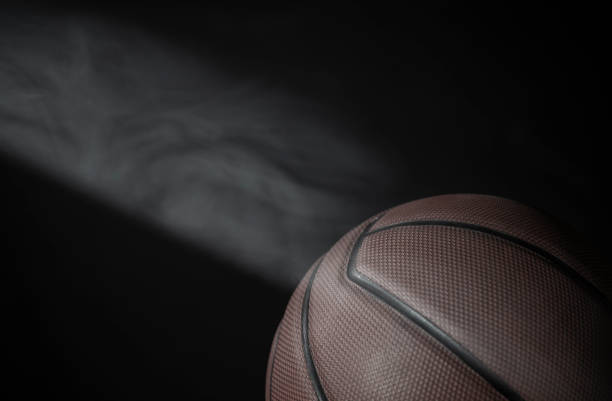 istock image of basketball smoke dark background 1327658654