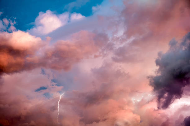 istock Beautiful dramatic sky with colorful clouds and thunderbolt at sunset 1327668272