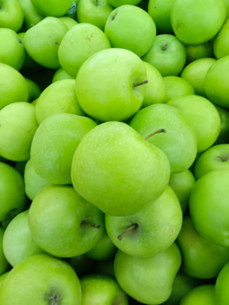 istock GREEN APPLE IN THE MARKET 1327672240