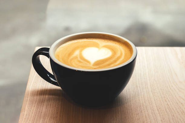 istock Cup of coffee on wooden table 1327674975
