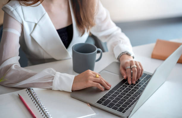 istock Close up hand woman typing on laptop computer keyboard in office. 1327677799
