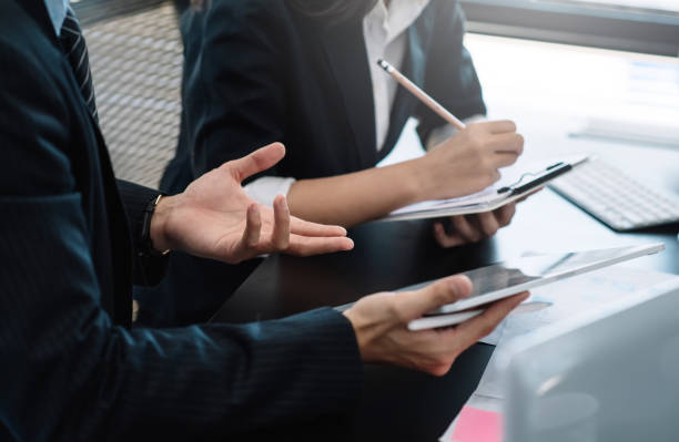 istock Business teamwork analyze graphs information with digital tablet and taking note in the office. 1327677826