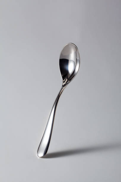 Italian Coffee Spoon from Bar (Cafeteria), Isolated on Gray Background