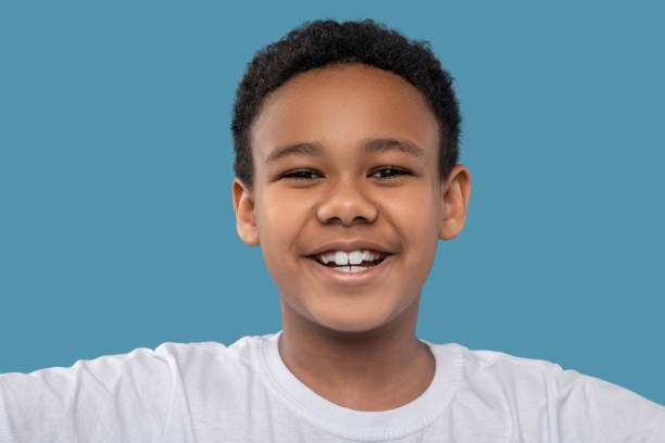 istock Joyful african american boy with toothy smile 1327679895