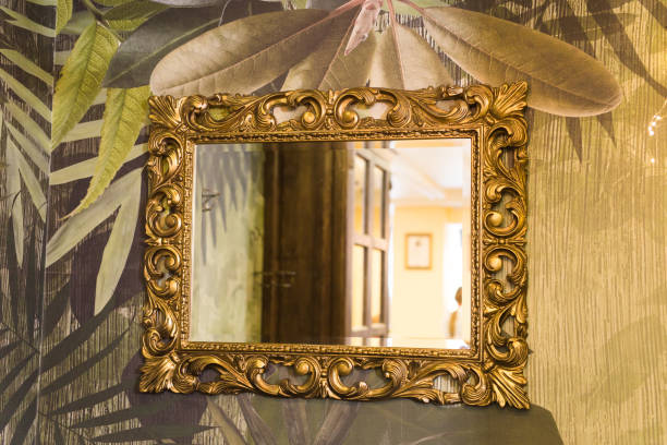istock Luxury vintage mirror with gold frame on the wall. Isolated inside 1327681277